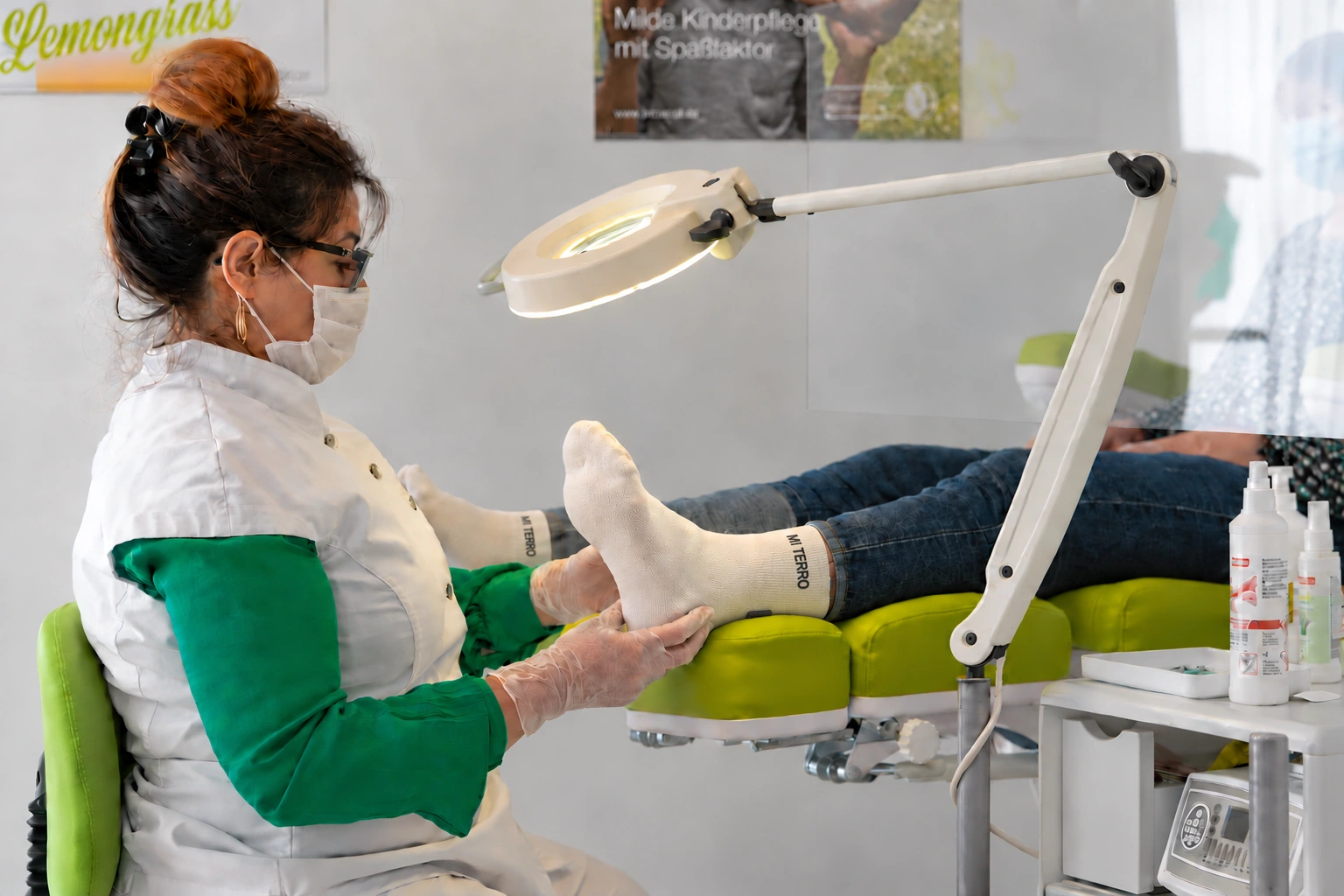 Real clinical foot-care photograph with cream Mi Terro socks digitally added to the patient’s feet