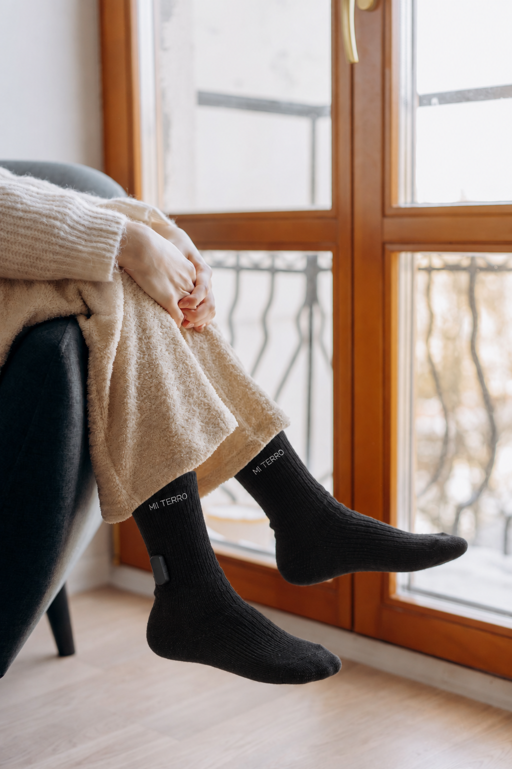 Black Mi Terro socks worn while resting at home