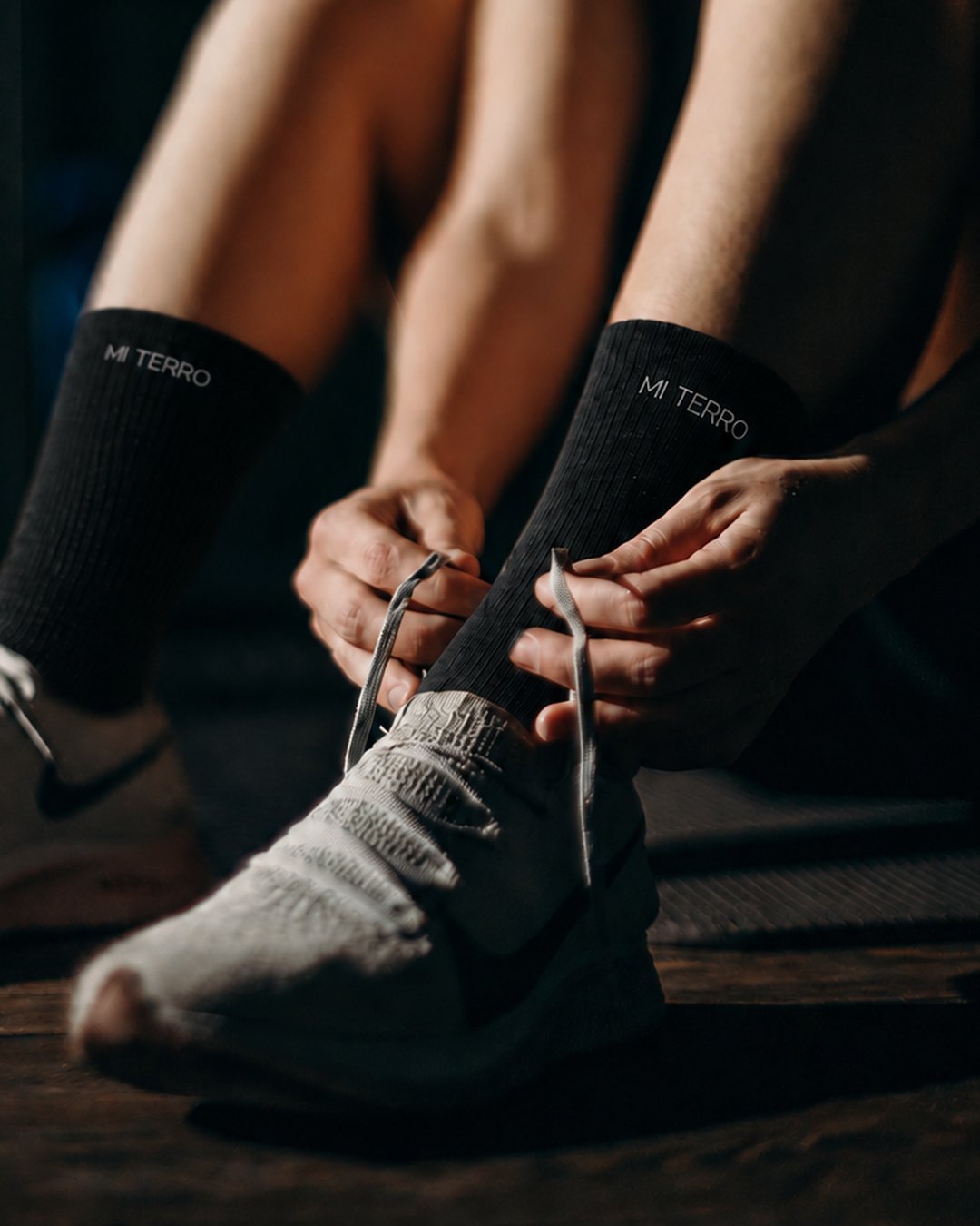 Athlete preparing to train in black Mi Terro socks